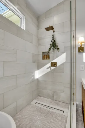 a view of a bedroom with furniture