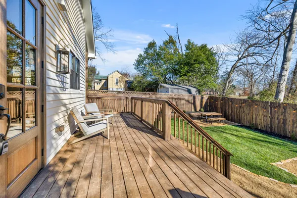 a view of balcony with wooden floor and outdoor seating