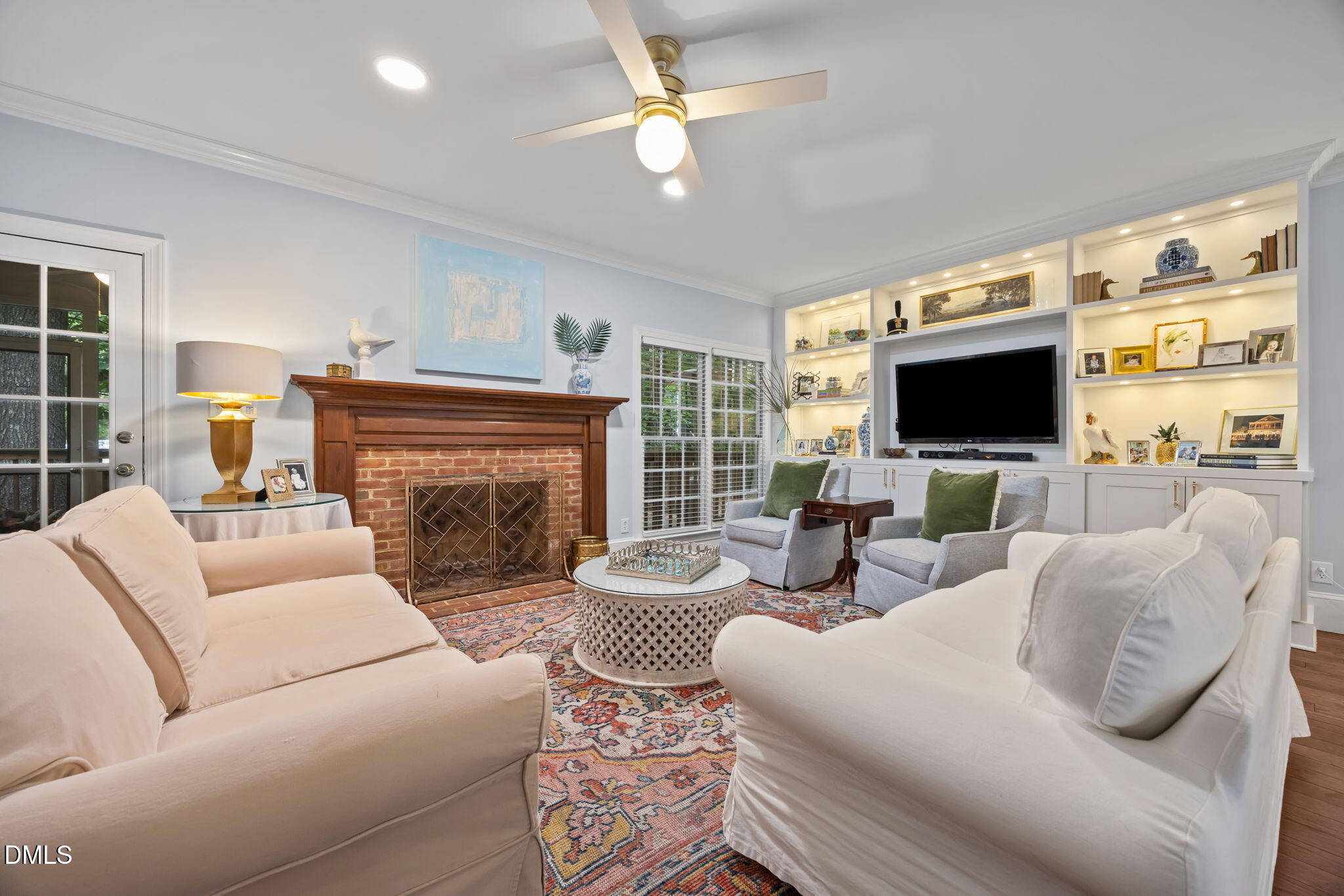 562 Weathergreen Drive Raleigh, NC 27615 - Photo 13 of 47 a living room with fireplace furniture and a flat screen tv