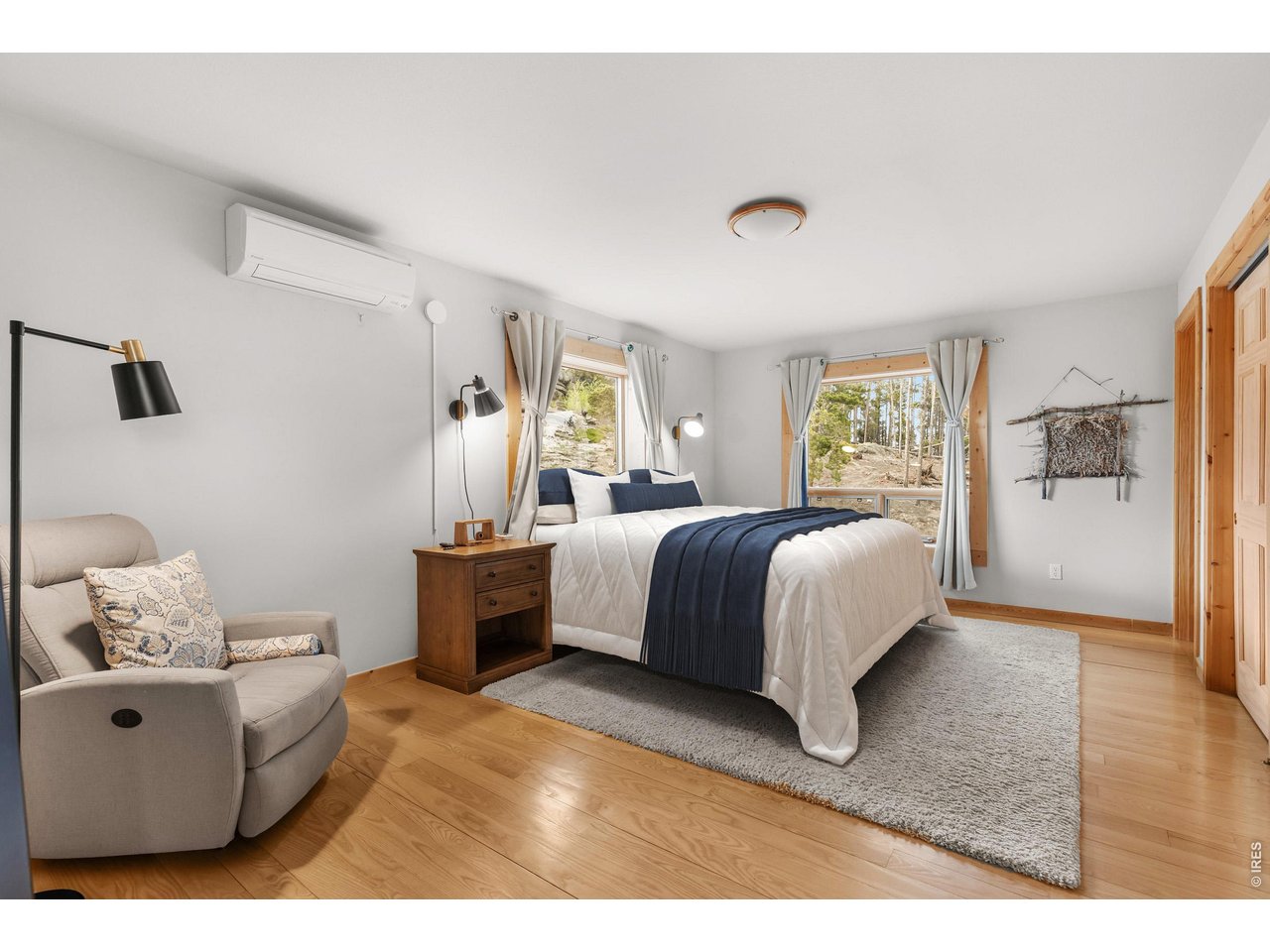 1028 Rudi Lane Golden, CO 80403 - Photo 31 of 46 a spacious bedroom with a bed and a window