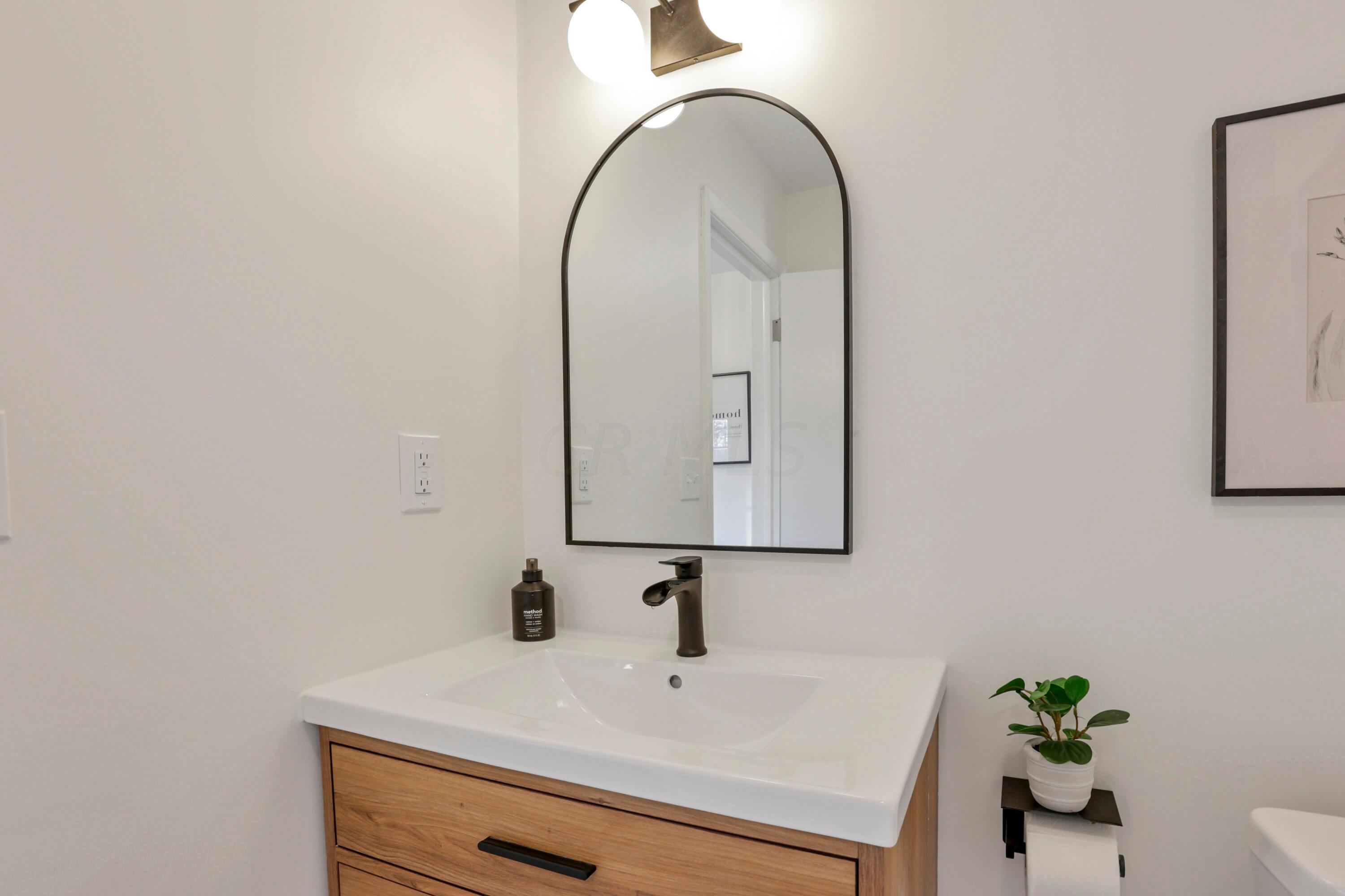 2275 Haverford Road Columbus, OH 43220 - Photo 22 of 57 The full bathroom on the first floor features new tile, vanity, fixtures and walk-in shower with glass door.