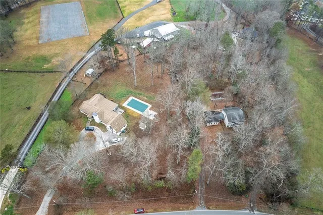 an aerial view of a house with outdoor space