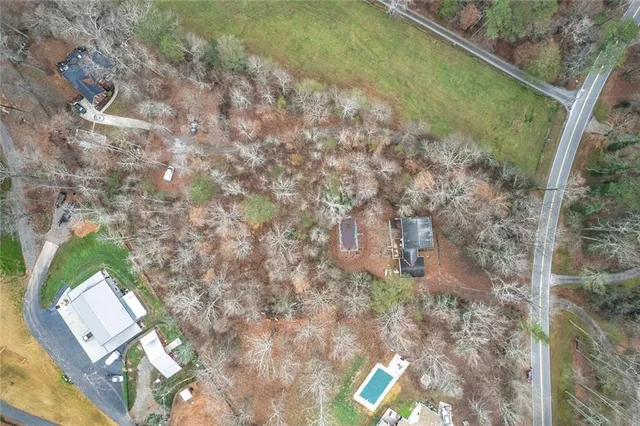 a view of a yard with large trees