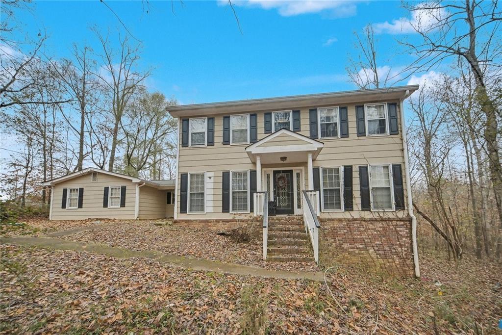 325 Ranchette Road Alpharetta, GA 30004 - Photo 2 of 25 a front view of a house with a porch