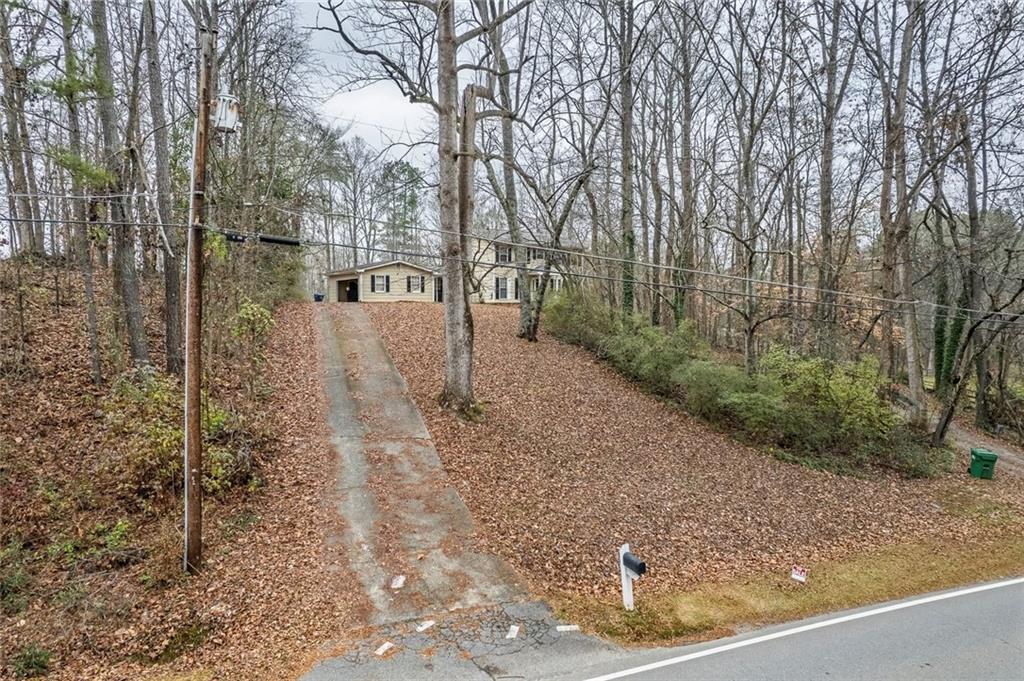 325 Ranchette Road Alpharetta, GA 30004 - Photo 24 of 25 a view of a yard with trees in front of it