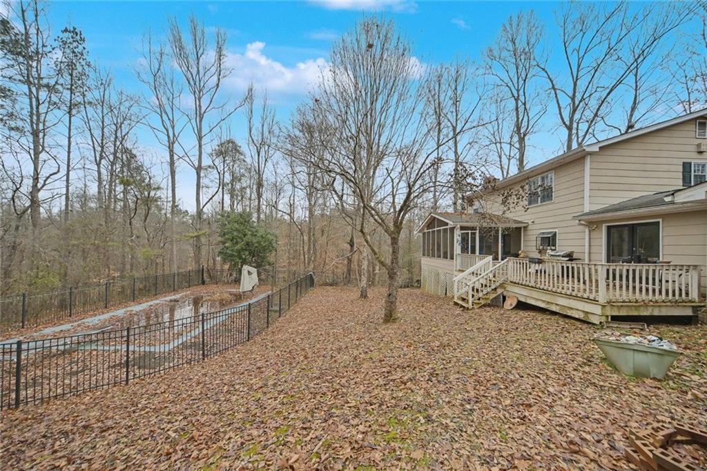 325 Ranchette Road Alpharetta, GA 30004 - Photo 6 of 25 a front view of a house with a yard