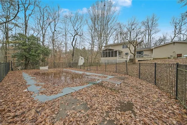 a view of a yard with a house and a snow