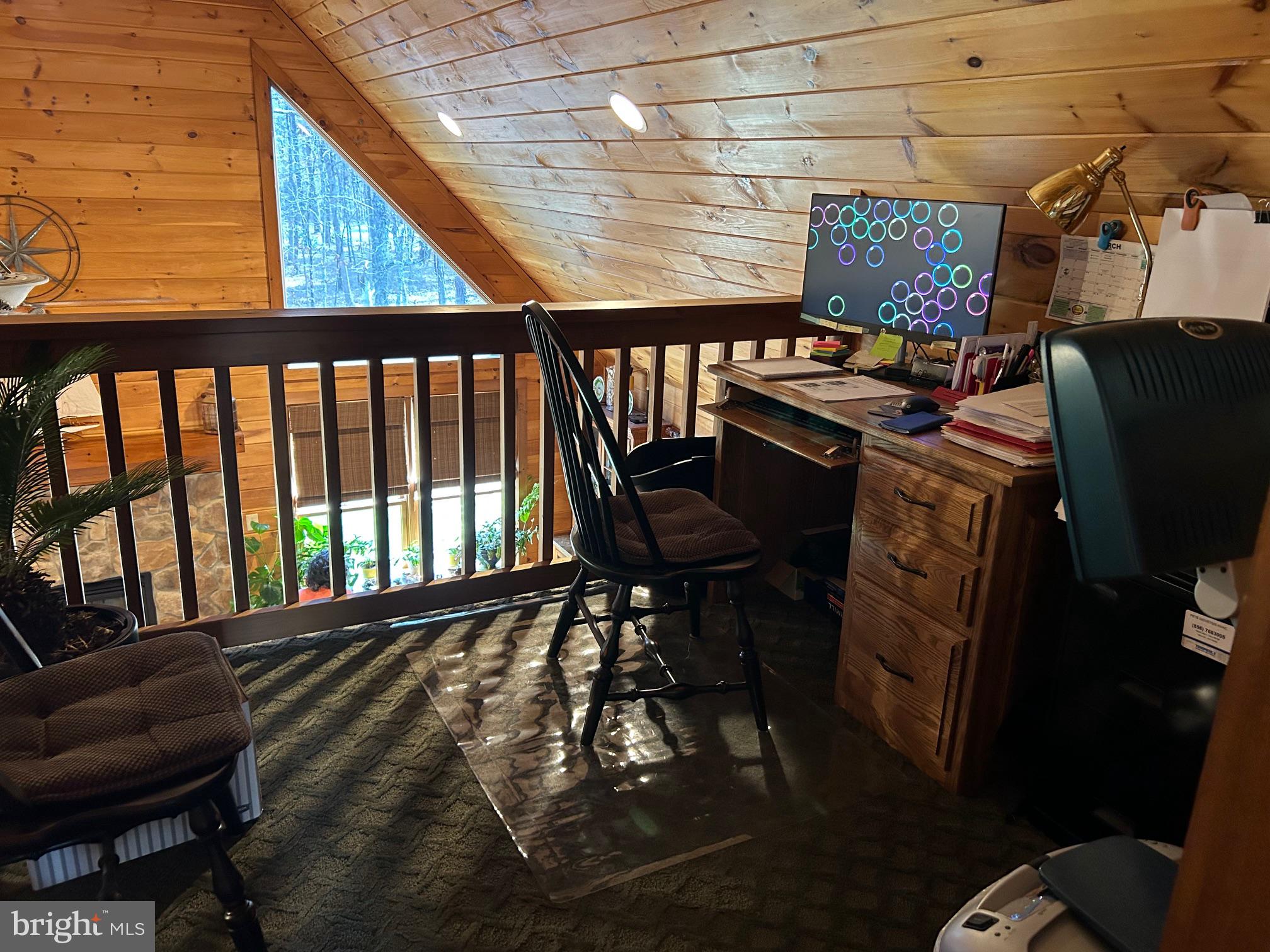 827 Weymouth Road Buena, NJ 08310 - Photo 25 of 41 Cozy loft workspace with wooden charm.