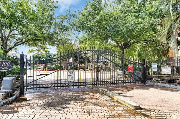 a view of a wrought iron fences in front of a house