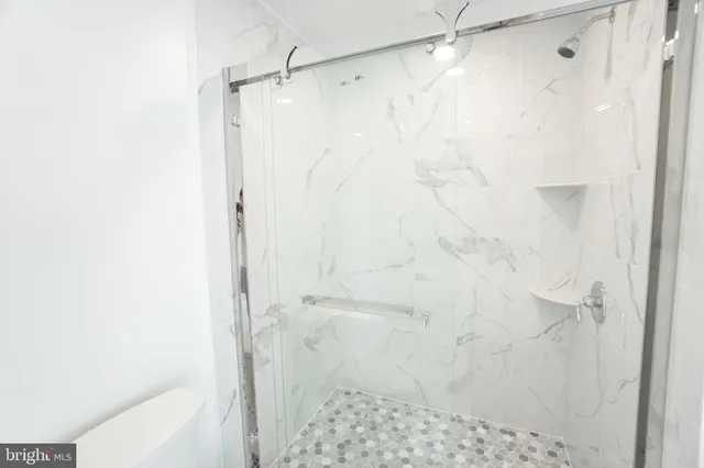 a bathroom with a toilet a sink and bathtub