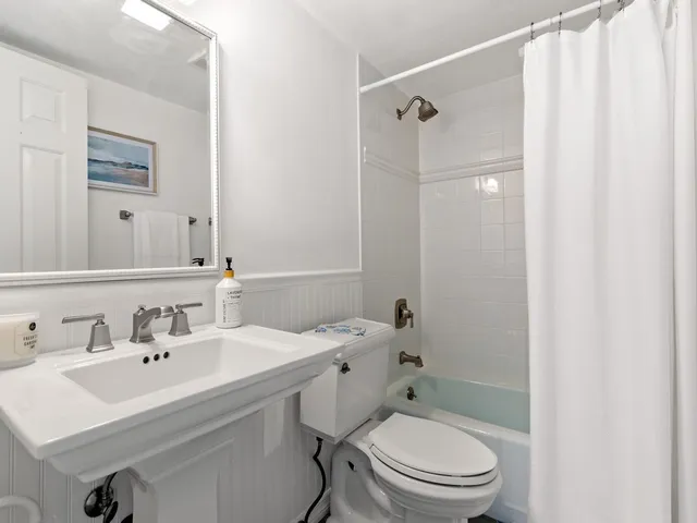 a room with a table and a mirror