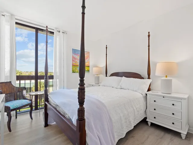 a bedroom with a bed and a table