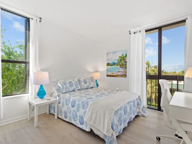 a view of swimming pool with outdoor seating and plants