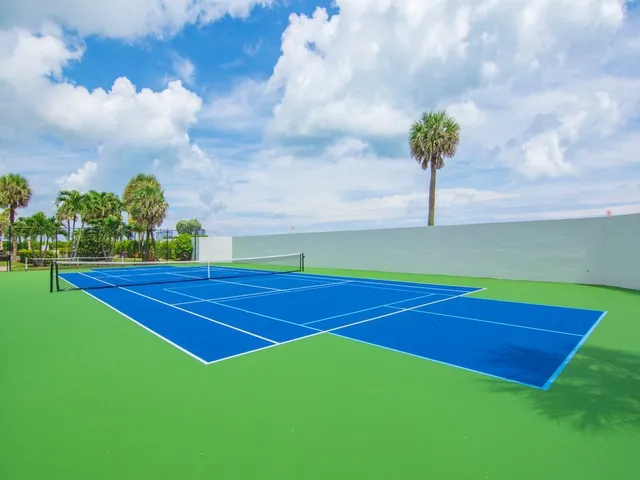 a view of yard with swimming pool and green space