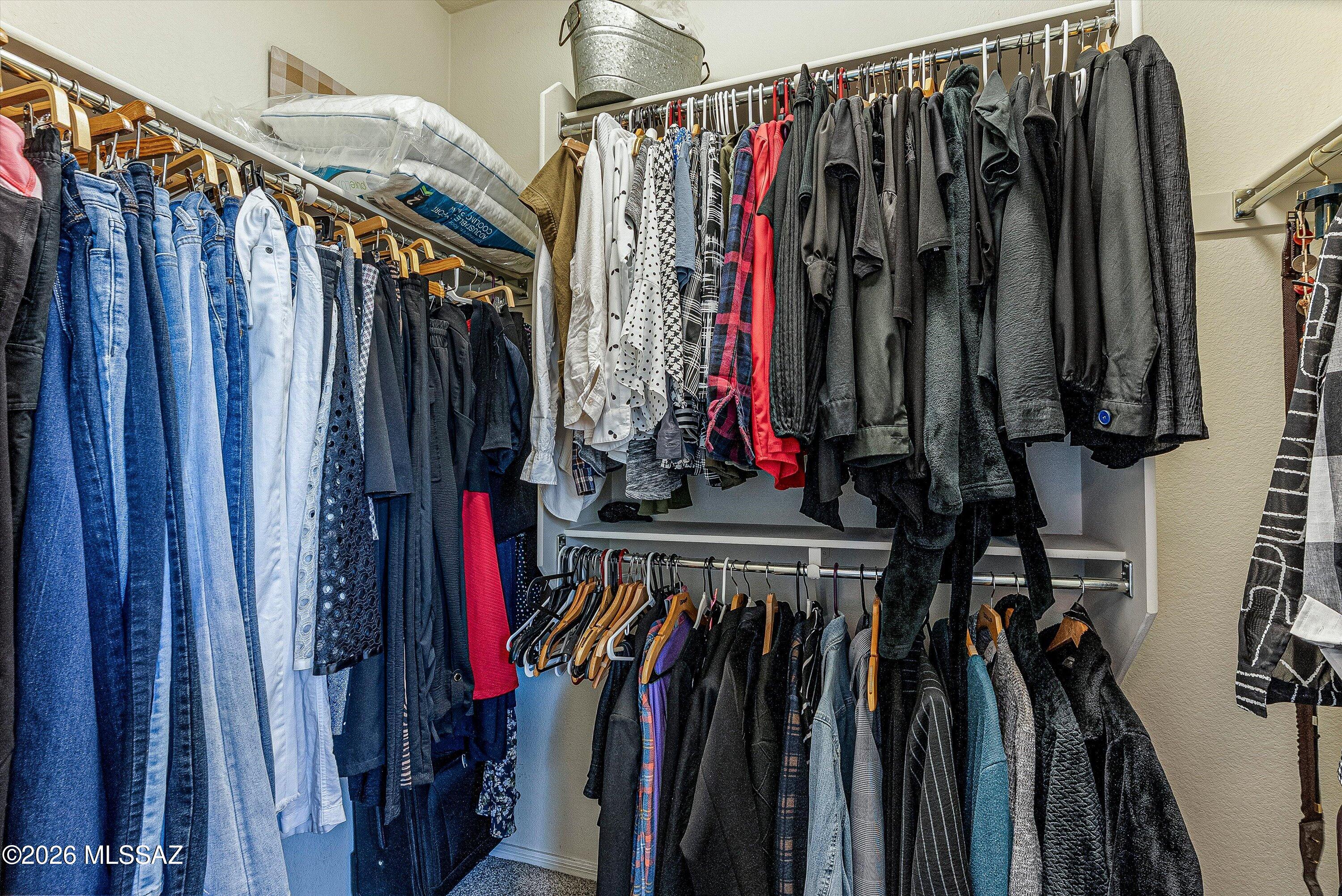 21163 East Treasure Road Red Rock, AZ 85145 - Photo 16 of 35 a view of walk in closet with clothes