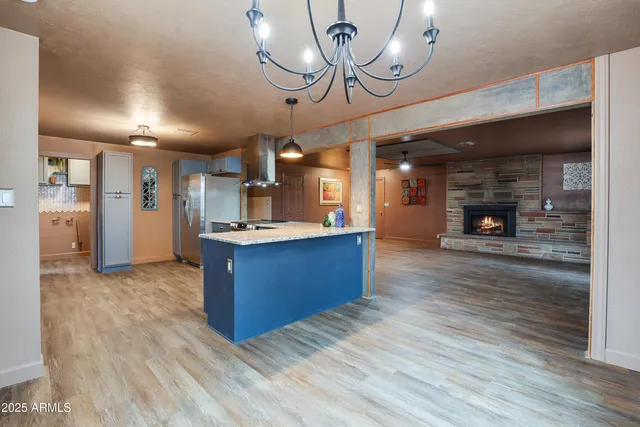 a kitchen with stainless steel appliances kitchen island a large island in the center