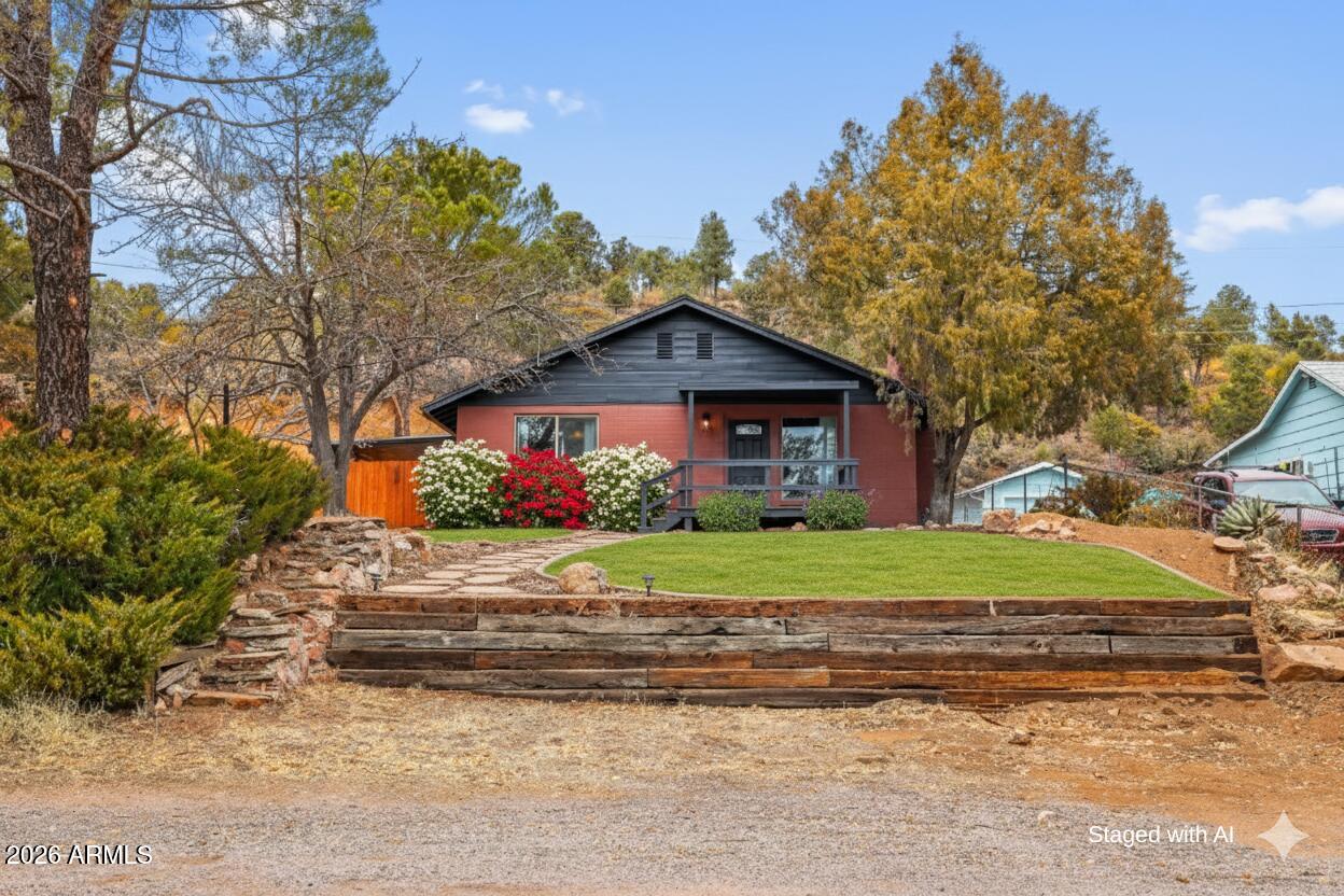 404 West Frontier Street Payson, AZ 85541 - Photo 2 of 39 a front view of a house with garden