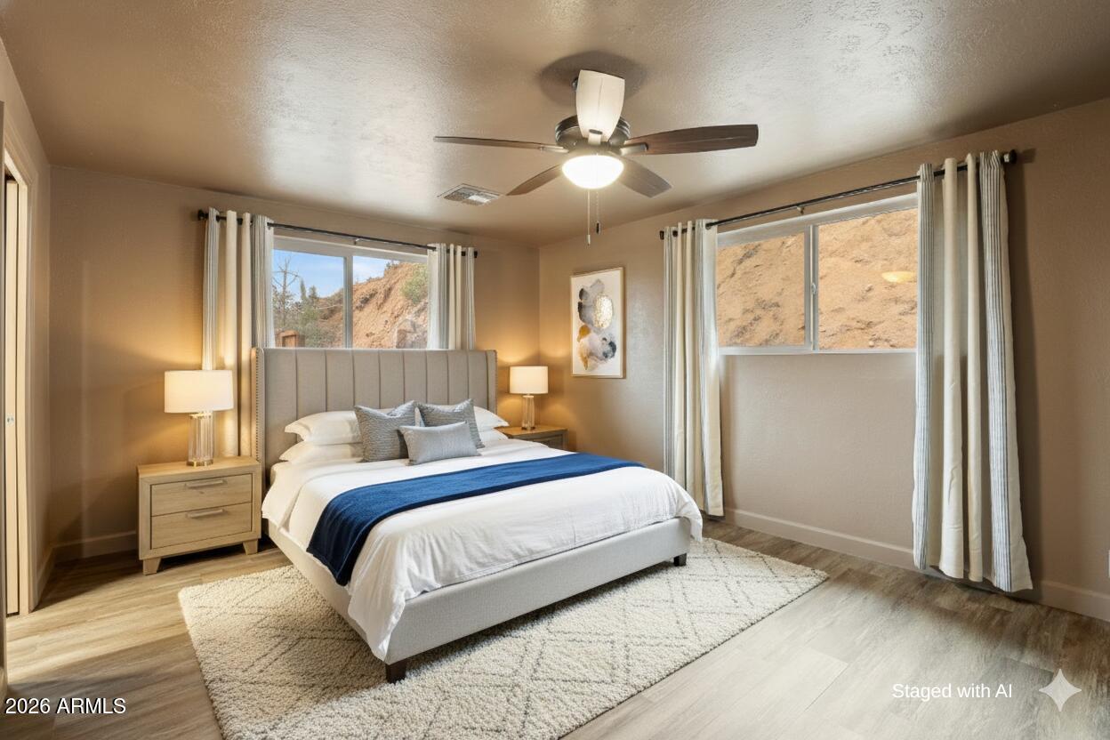 404 West Frontier Street Payson, AZ 85541 - Photo 27 of 39 a bedroom with a large bed and a window