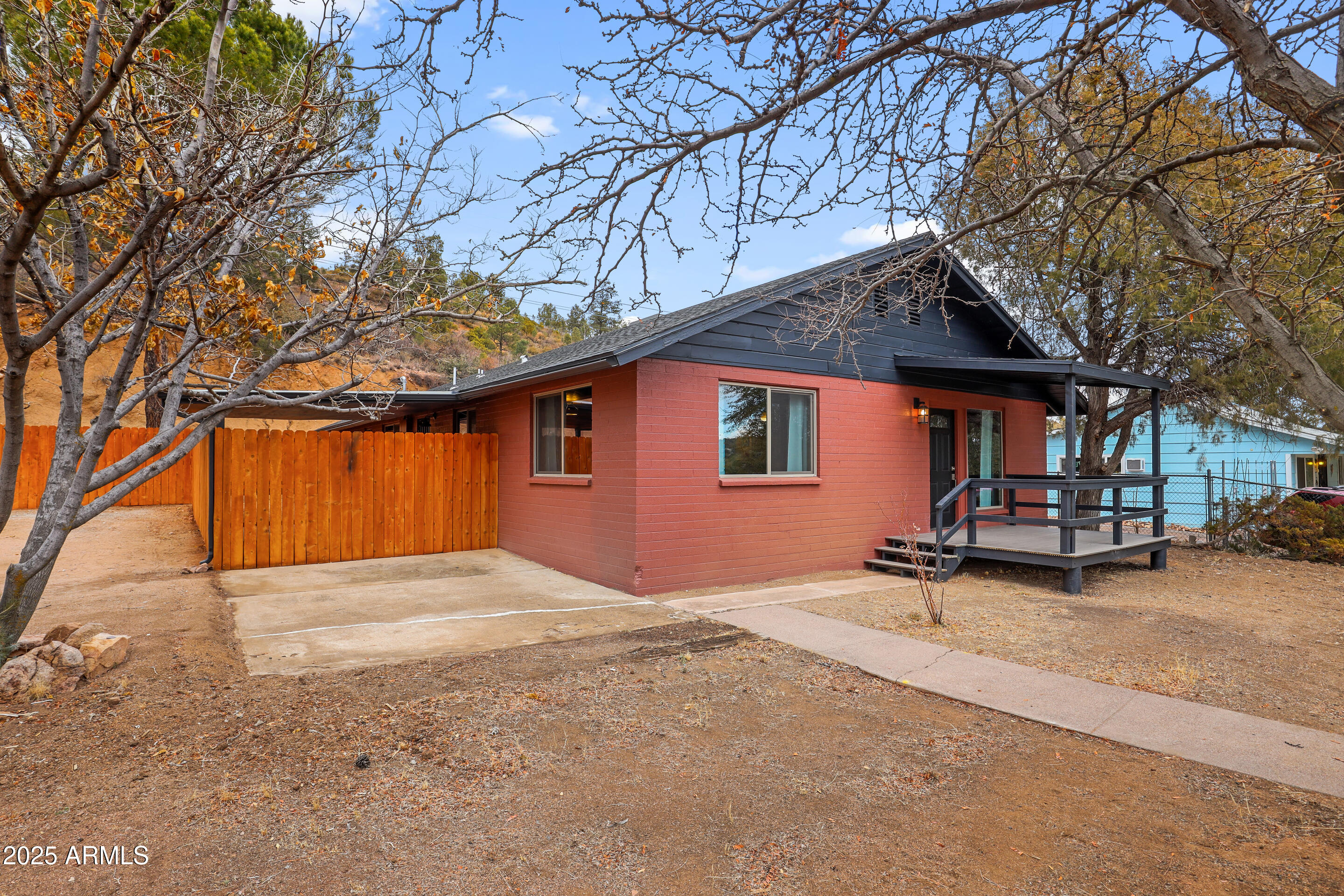 404 West Frontier Street Payson, AZ 85541 - Photo 4 of 39 a backyard of a house with table and chairs under an umbrella