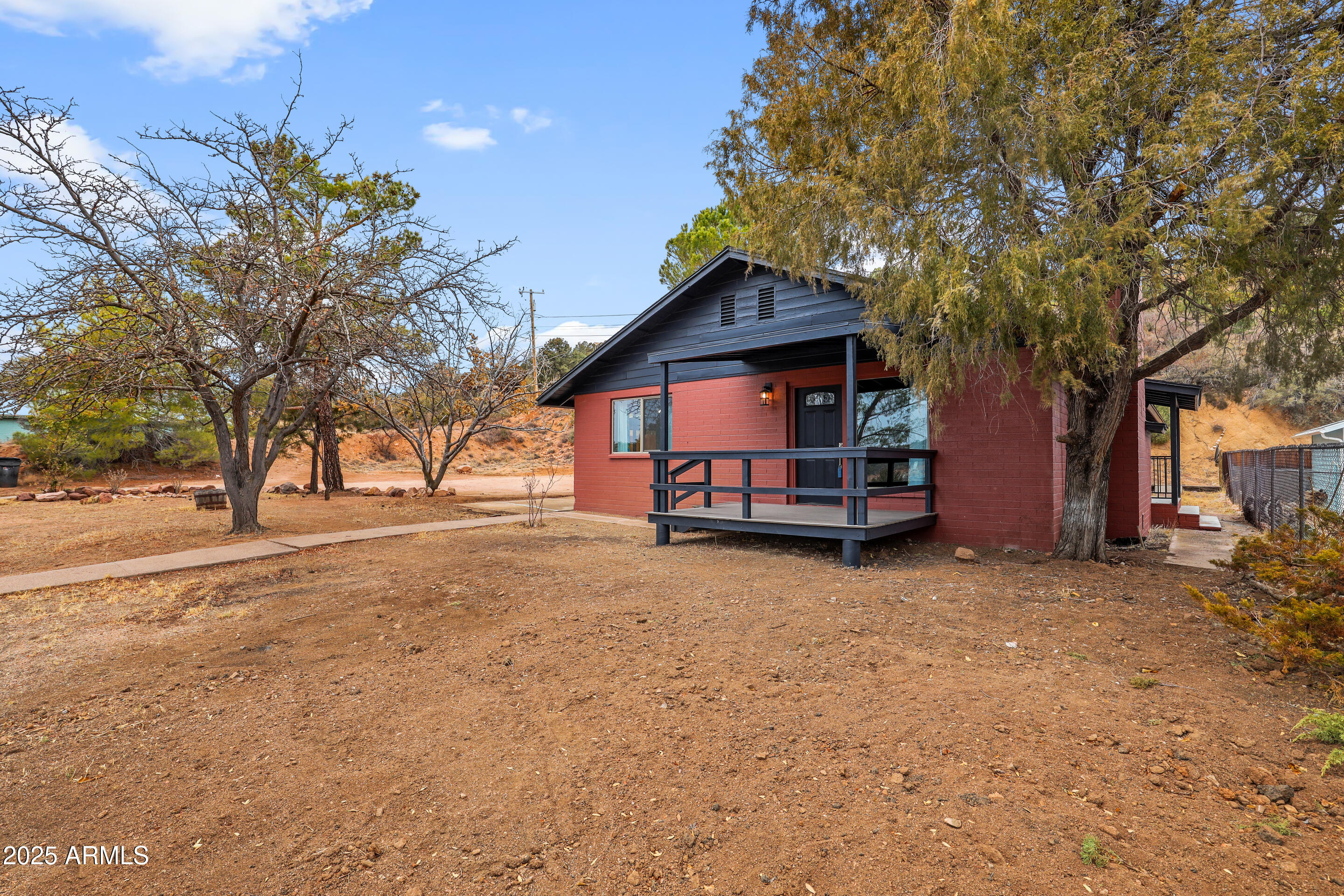 404 West Frontier Street Payson, AZ 85541 - Photo 5 of 39 a view of a house with a large tree and a yard