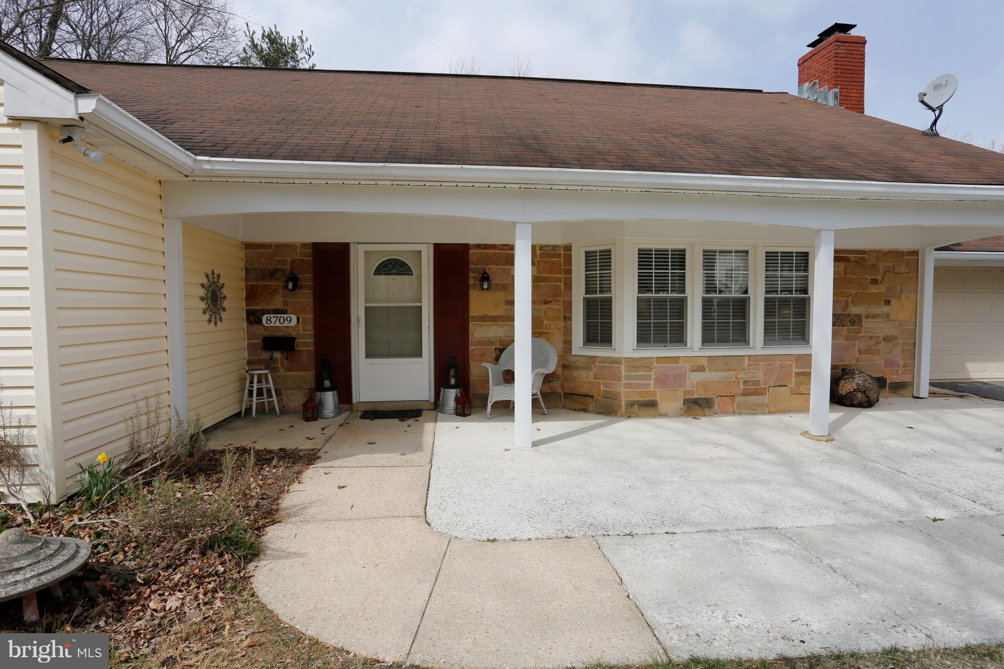 Covered porch welcomes guests