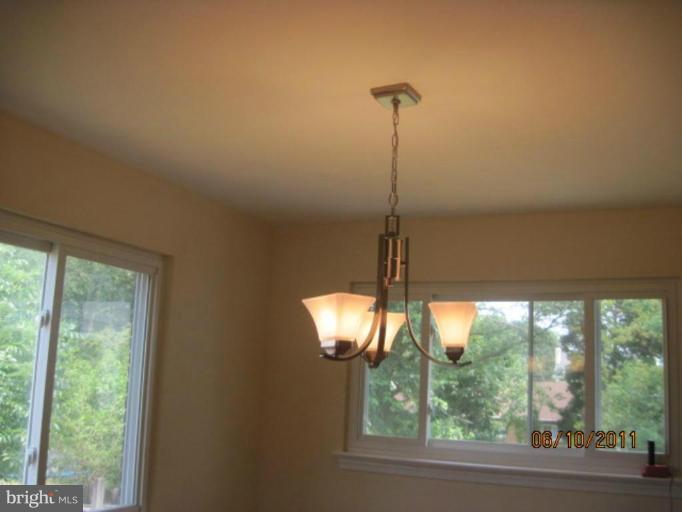 6013 Brunswick Street Springfield, VA 22150 - Photo 11 of 18 a view of a room with a window and cabinets