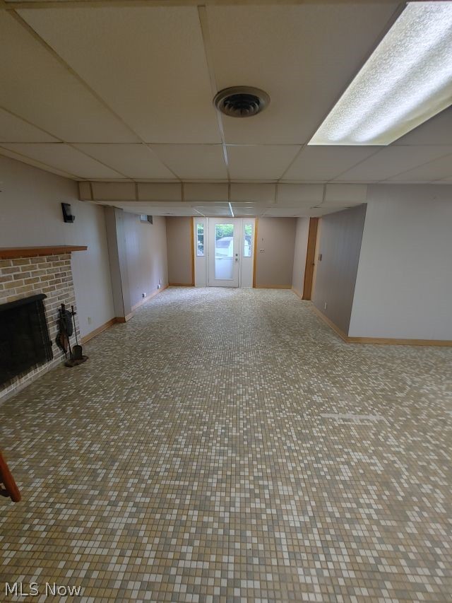 2211 Devonshire Road Northwest Canton, OH 44708 - Photo 29 of 36 Basement featuring a fireplace and a drop ceiling