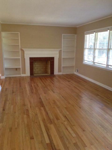 1720 Upper River Road, Unit 2 Macon, GA 31211 - Photo 3 of 8 an empty room with windows and a fireplace