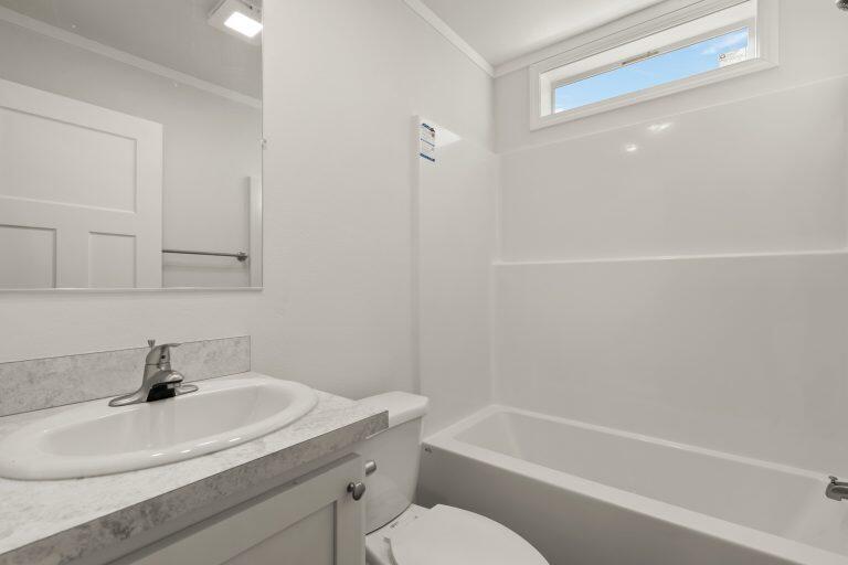 6850 Downing Road, Unit SPC 11 Central Point, OR 97502 - Photo 6 of 18 a bathroom with a sink toilet and shower