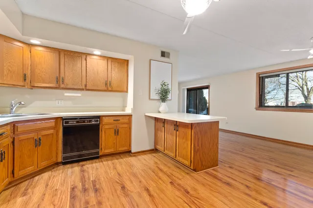 a kitchen with stainless steel appliances granite countertop a stove and a sink