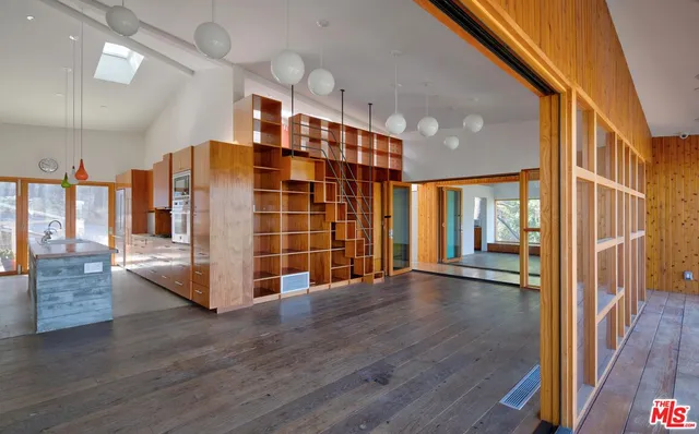 a view of a porch with wooden floor and stairs
