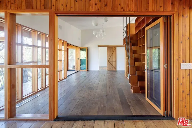 a view of balcony with wooden floor