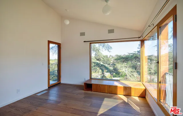 a bathroom with a shower and a glass door