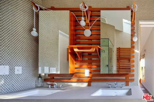 a view of a room with wooden floor and a window