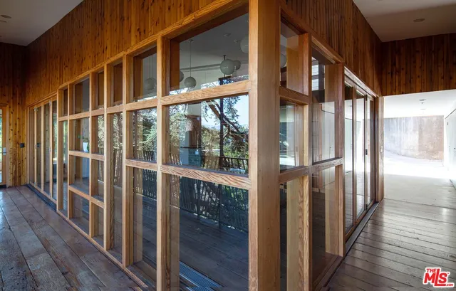 a view of a living room and wooden floor