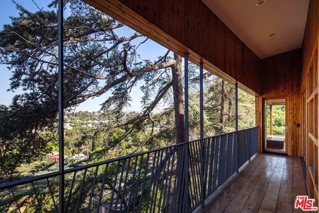 a kitchen that has a stove and a wooden cabinets