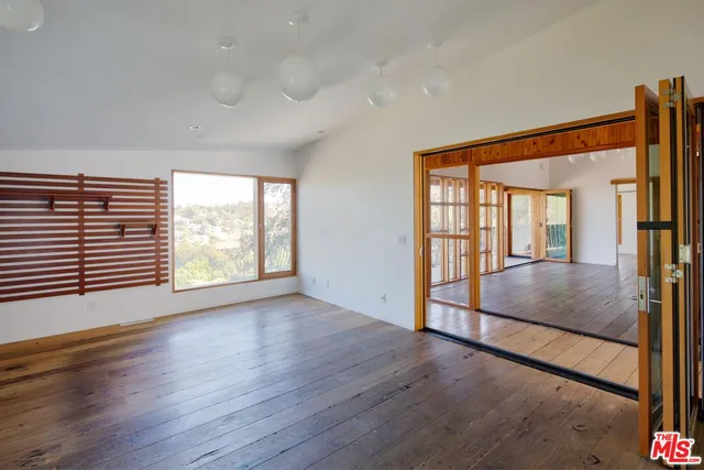 a view of an empty room and window