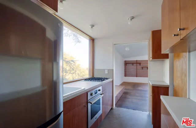 a bathroom with a sink toilet and a mirror