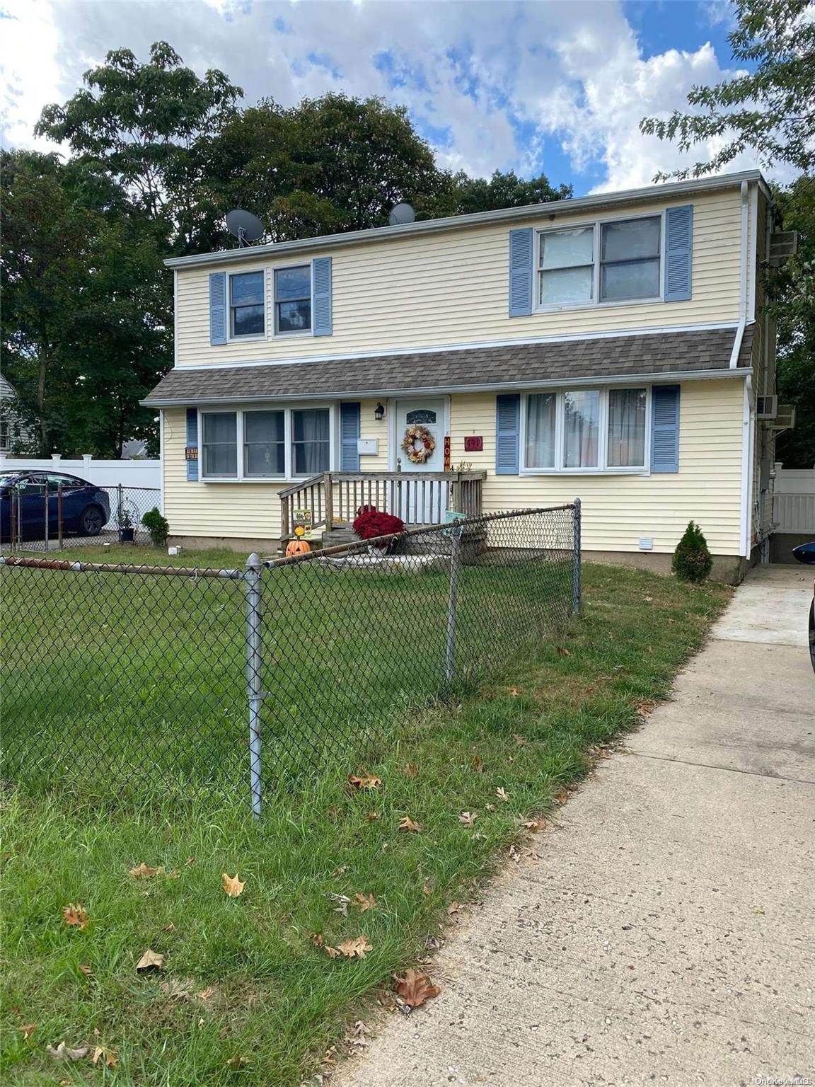 191 Mark Tree Road Centereach, NY 11720 - Photo 1 of 1 a front view of a house with a yard