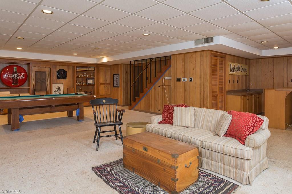 2206 Red Forest Road Greensboro, NC 27410 - Photo 22 of 30 Place for everyone to enjoy. Wet bar, sitting area and pool area. Could be a separate living quarters too. Has it's own entrance. Do you have an Parents, In-law or College graduate wanting to move in?