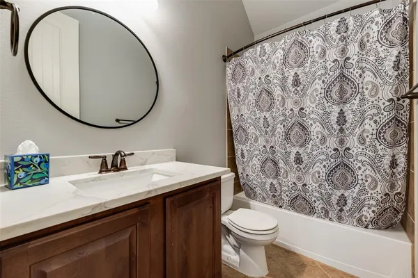 a bathroom with a sink and mirror
