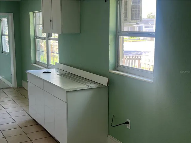a bathroom with a sink and vanity