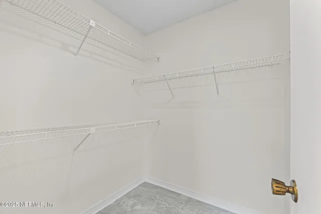 a view of a room with racks on the wall