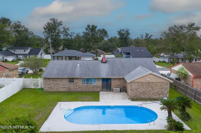 a view of a big yard in front of house