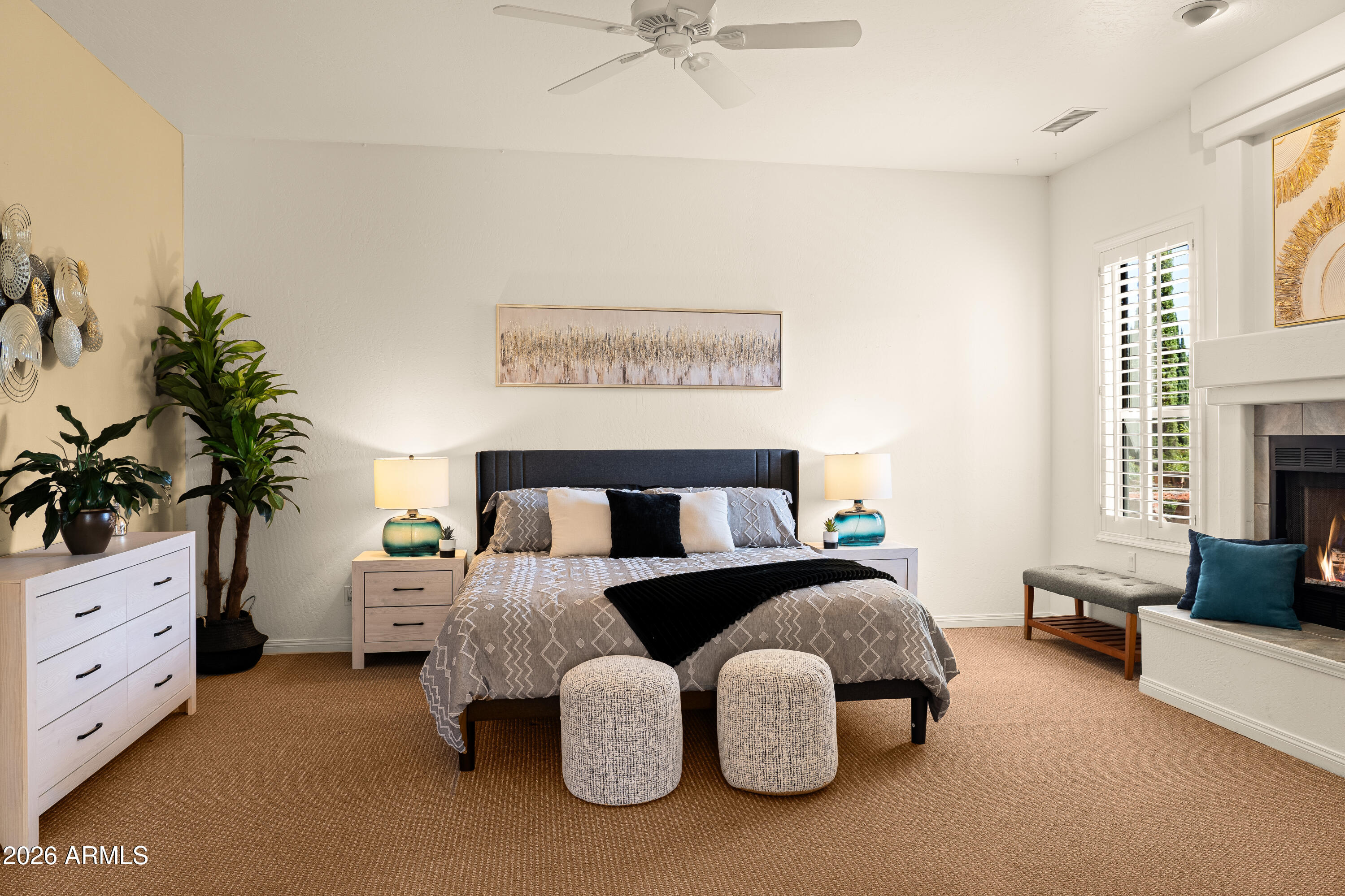 39 Rim Trail Circle Sedona, AZ 86351 - Photo 17 of 41 a spacious bedroom with a bed and a potted plant