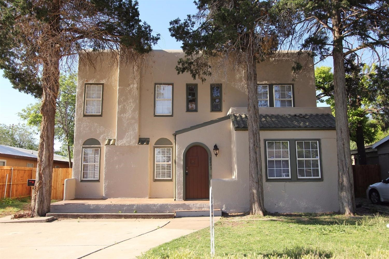2203 20th Street Lubbock, TX 79411 - Photo 1 of 10 a front view of a house with garden