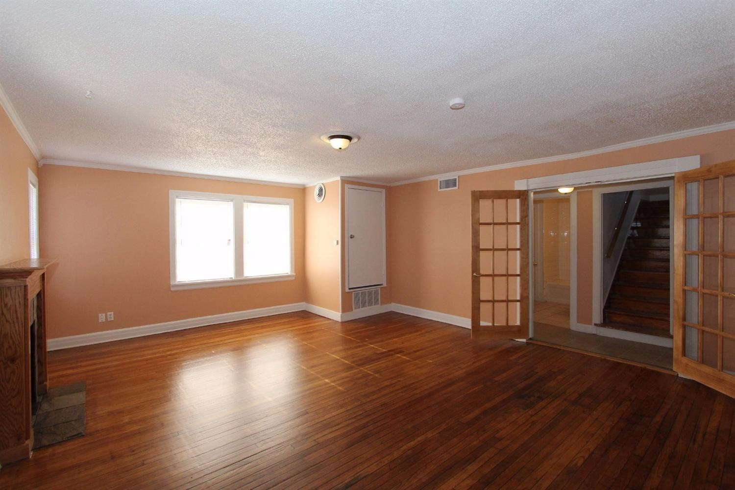 2203 20th Street Lubbock, TX 79411 - Photo 2 of 10 a view of an empty room with wooden floor and window