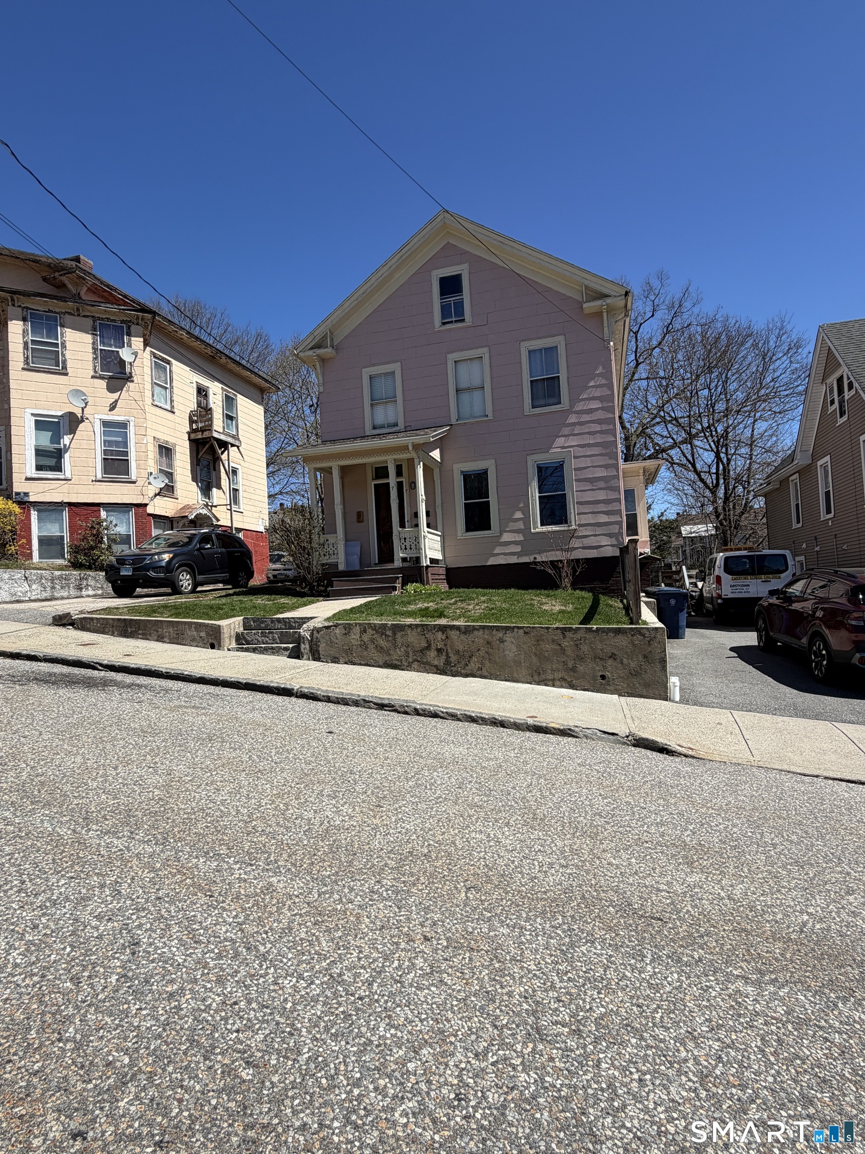 7 Turner Street Windham, CT 06226 - Photo 9 of 21 a front view of residential houses with street