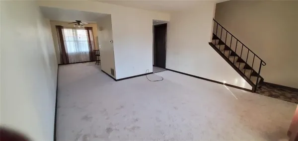 a view of a hallway with staircase