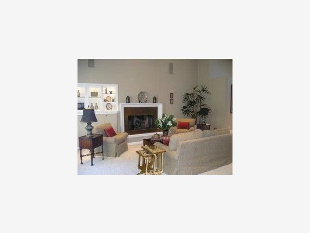 757 Edgewood Road San Mateo, CA 94402 - Photo 2 of 9 a living room with furniture and a fireplace